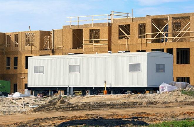 crane lifting modular building for construction office rentals in Eaton OH